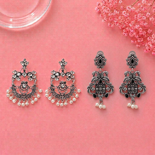 Carved Charm Dangler earrings (White) Feathered Grace dangler earrings (Black) Combo set