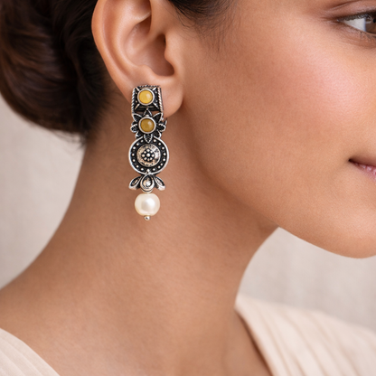 Peacock glow stone studded dangler earrings (White) Wonderful wildflower oxidised stud earrings (Yellow) Combo set
