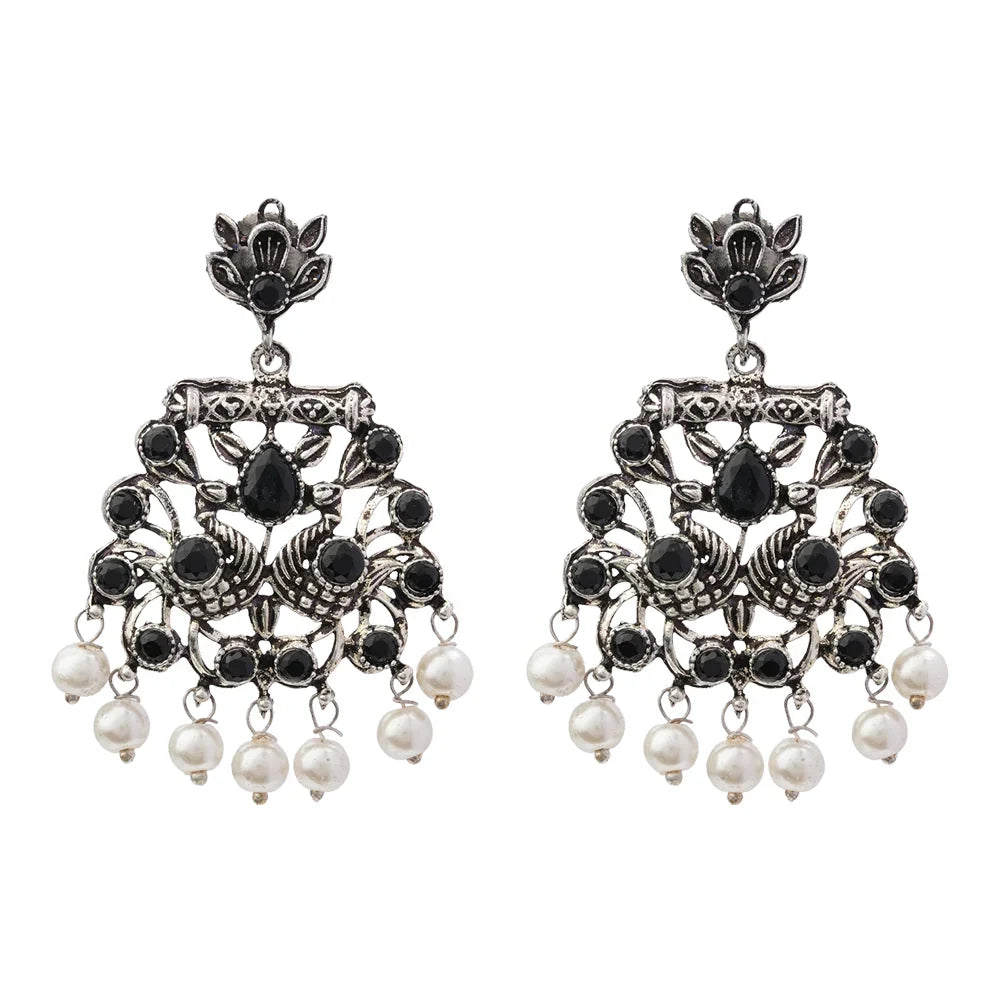 Peacock glow stone studded dangler earrings (White) Peacock glow stone studded dangler earrings (Black) Combo set