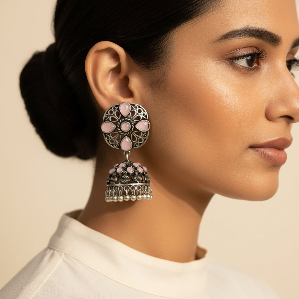 Oxidised Floral Jhumka earring with Baby pink stone detailing.