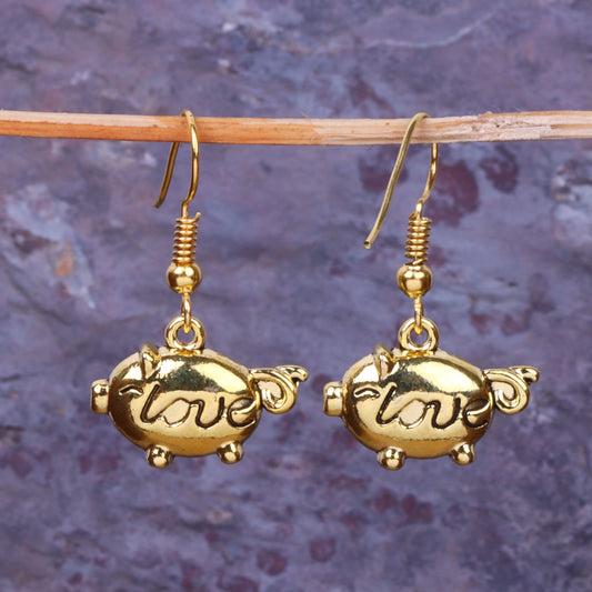 Treasure oink dangler earrings